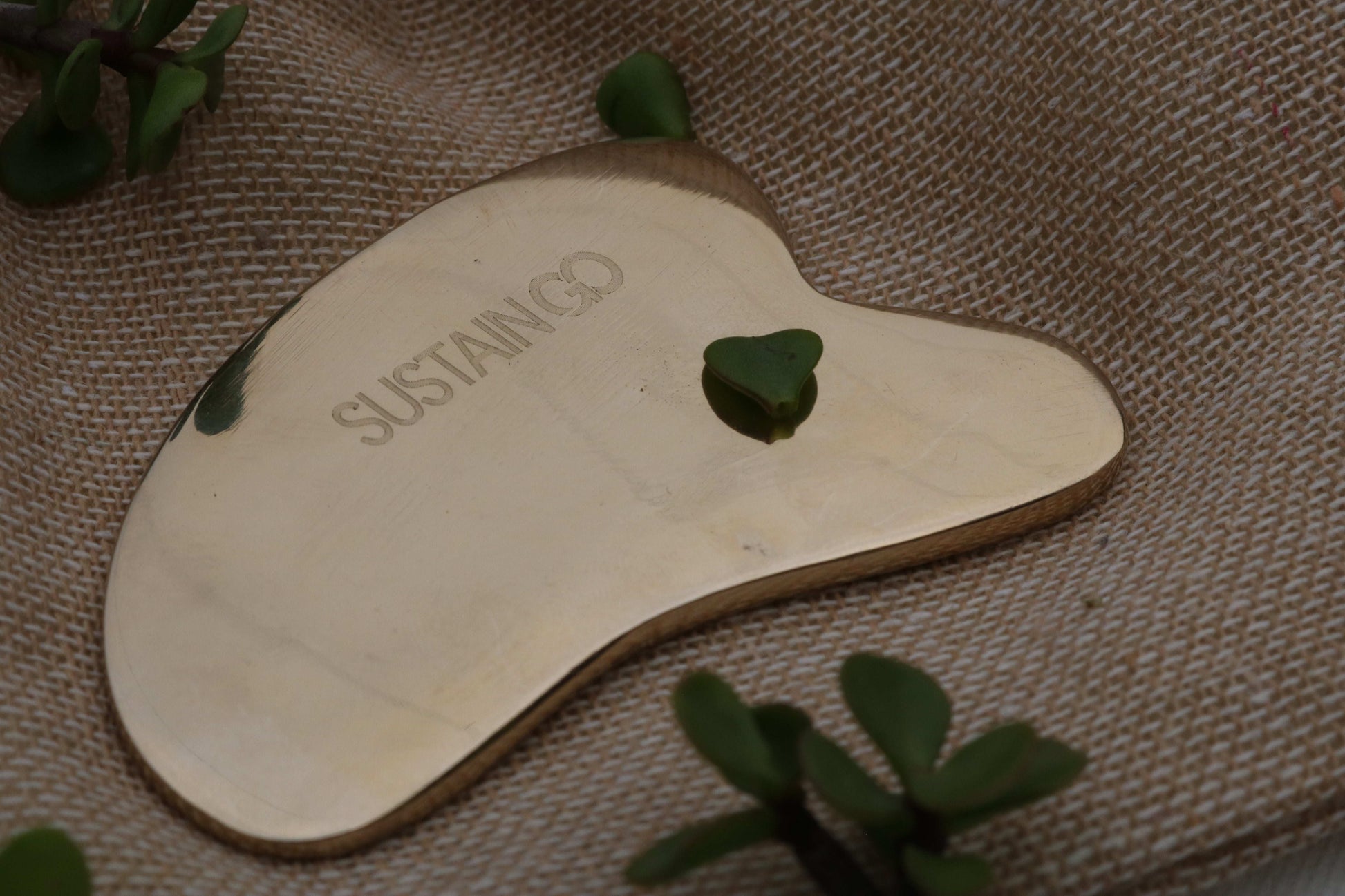 Close-up of SustainGo Gua Sha Facial Tool made from authentic Kansa metal – perfect for face massage, sculpting, and lifting