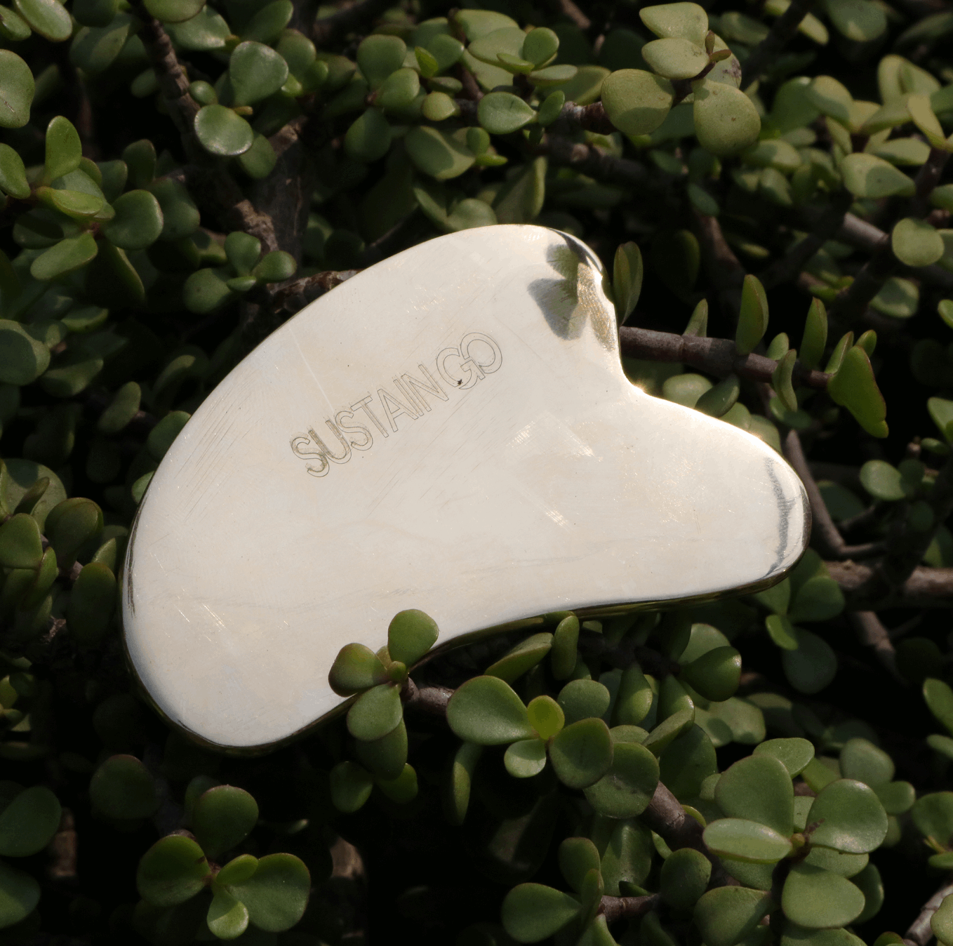 Gua Sha facial tool by SustainGo made of authentic Kansa metal – natural face massage tool for sculpting and glow